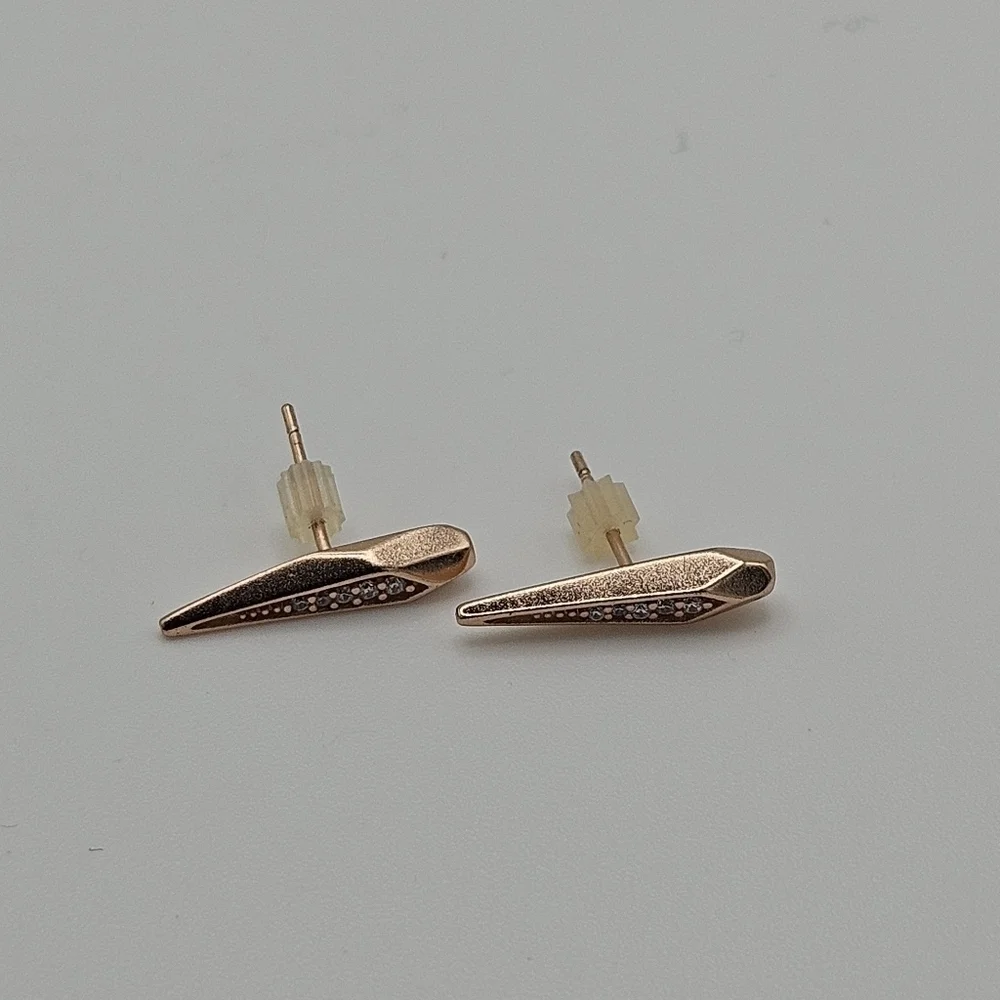 Kendra Scott rose gold spike earrings with clear crystals